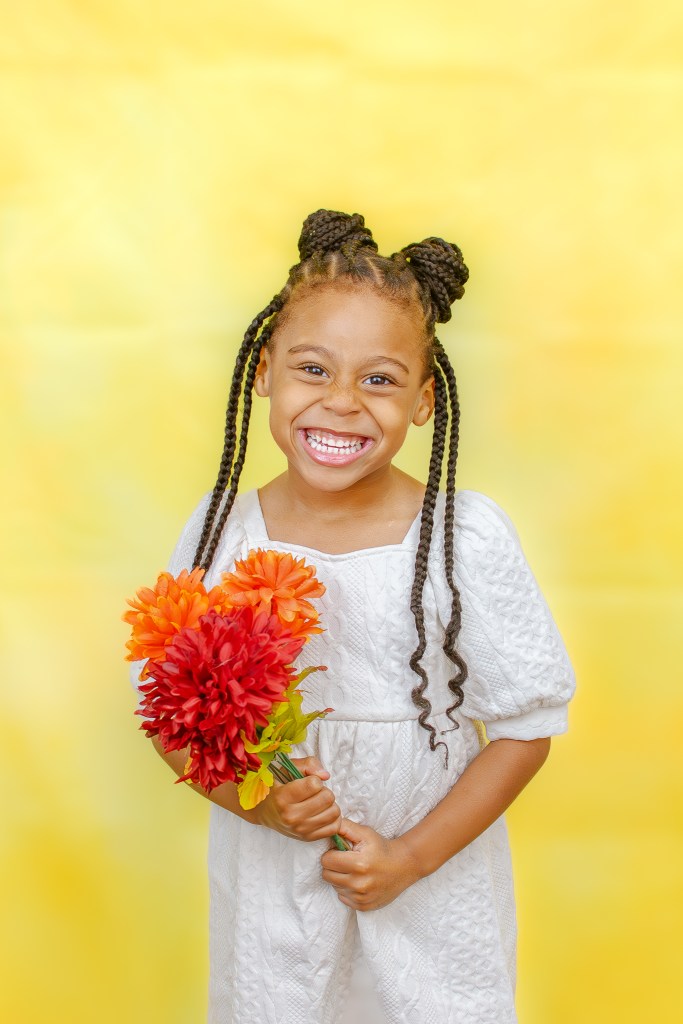 Boutique holiday school portraits by Phoenix Productions ATL featuring cheerful, colorful studio backdrops for children in Atlanta.