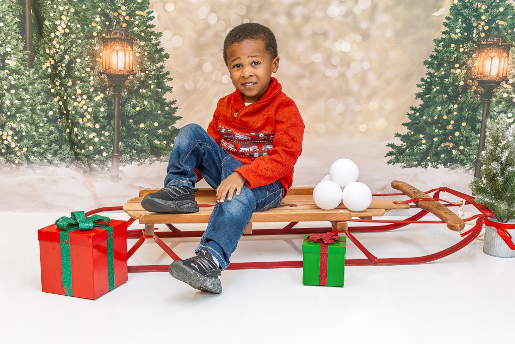 Boutique holiday school portraits by Phoenix Productions ATL featuring cheerful, colorful studio backdrops for children in Atlanta.